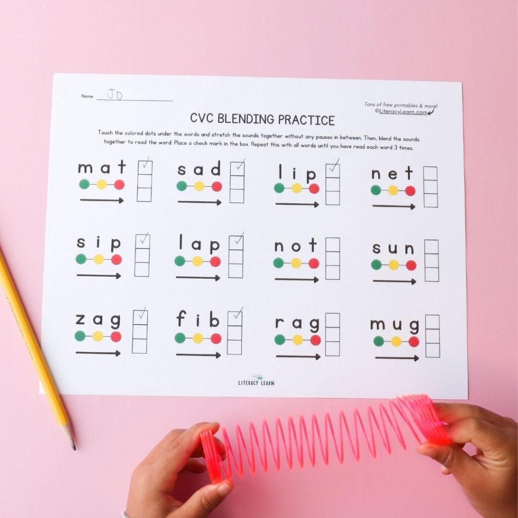 Photo of blending sheets practice worksheet with child's hands and slinky.