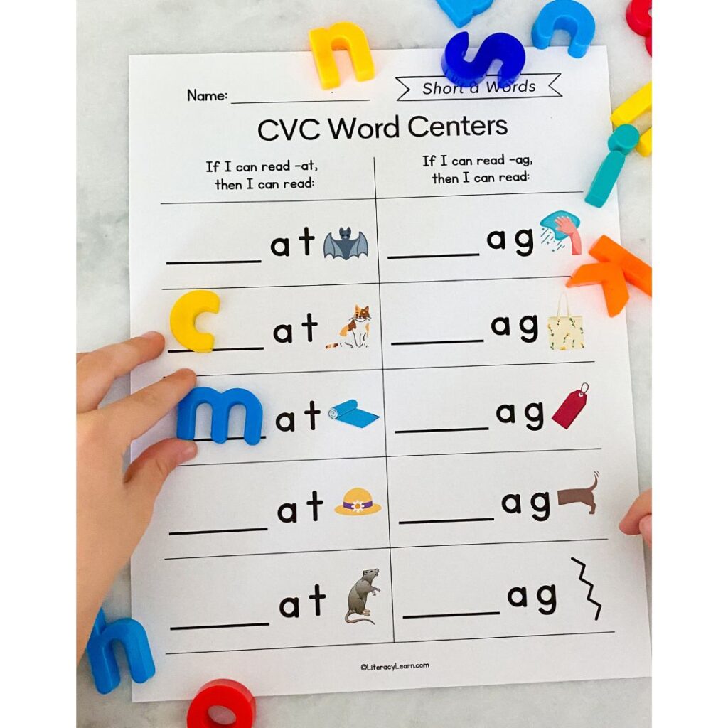 Close up photo of a child's hand completing the word center worksheet.