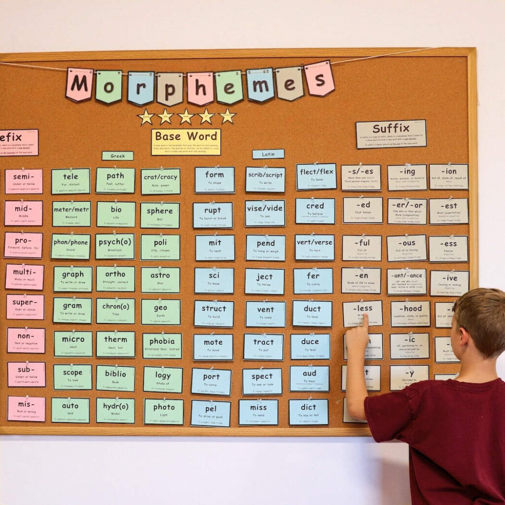 A child standing near the morpheme wall.