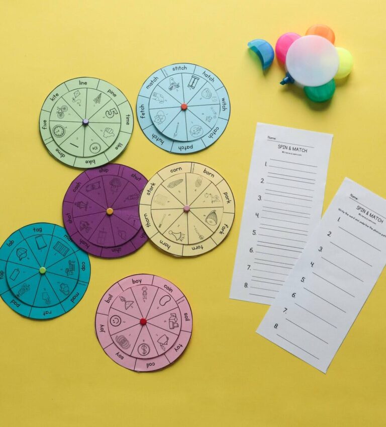 Photo of a variety of spinner activities and recording sheet on yellow background.